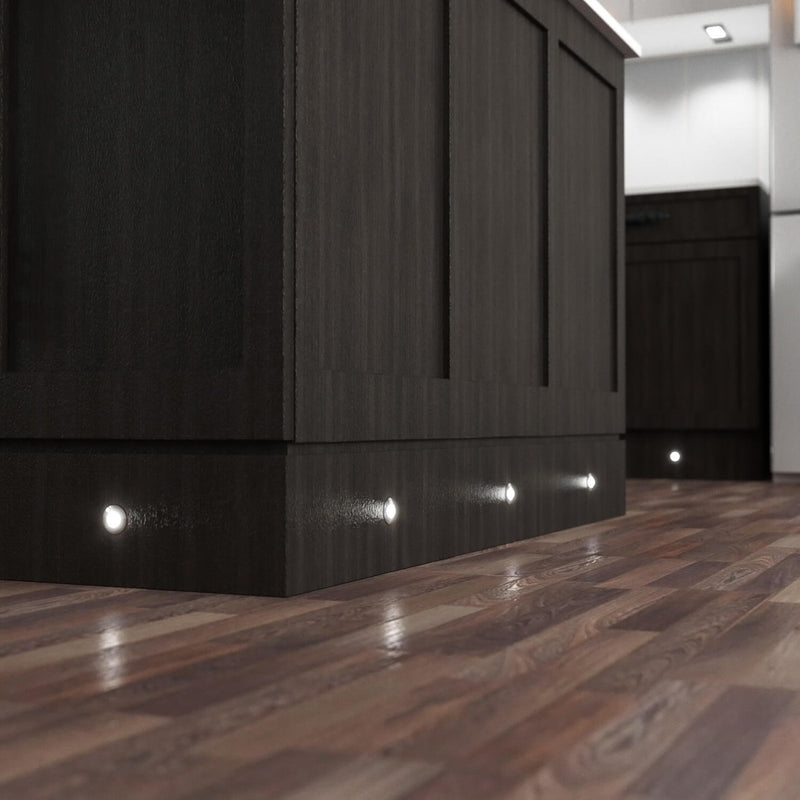 Sideview of LED plinth lights with natural white light on a kitchen island