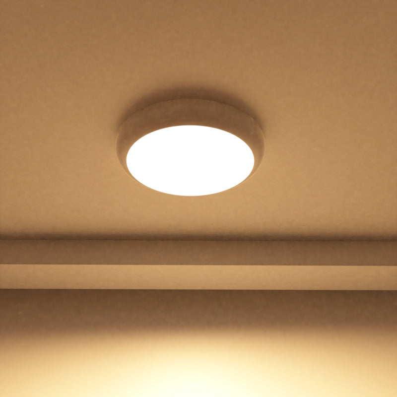 close up of a mounted LED bulkhead light with warm white light