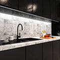 mid shot of a kitchen with mounted black LED profile with white diffuser