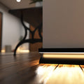 Simple Lighting - PRO-SKIRT-MB-2M - Black Skirting Profile Installed - Zoom In - Warm White