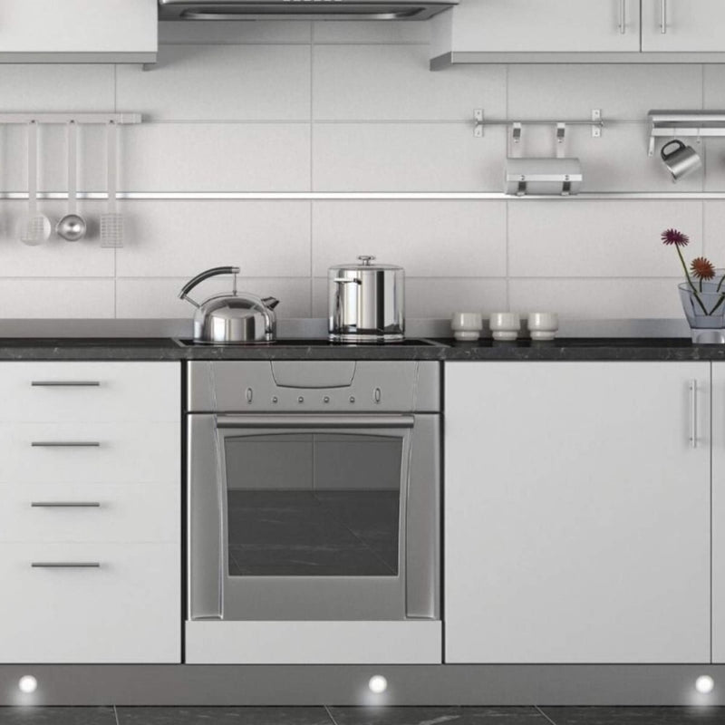 Mid shot of a kitchen with LED plinth lights