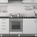 Mid shot of a kitchen with LED plinth lights