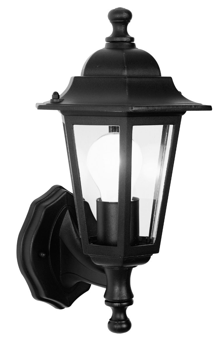 A black lantern with clear glass panels with a glowing white light bulb inside, white background.