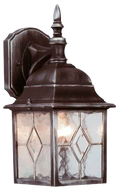 An image of a back and silver lantern with a warm glow on a white background.