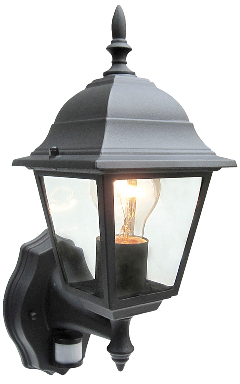 A black wall lantern with clear glass panels and a warm light bulb on a white background.