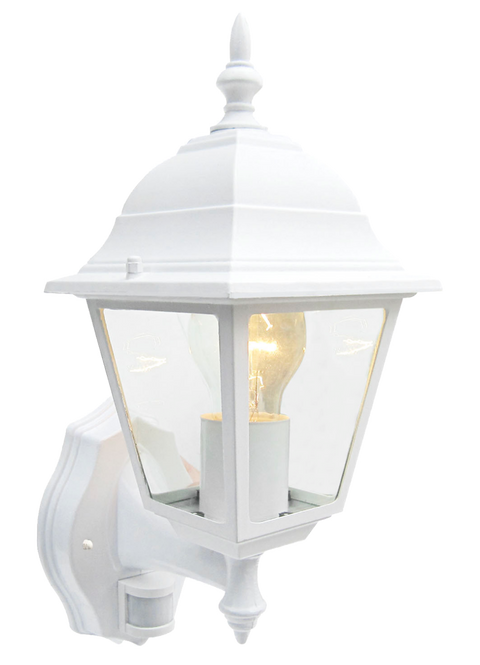 A white lantern with clear glass panels and a visible light bulb glowing with a warm glow on a white background.