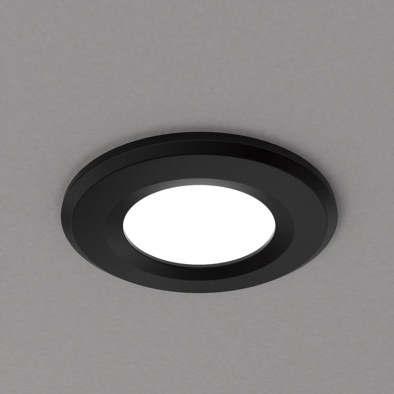 close up of a mounted black fire-rated LED downlight