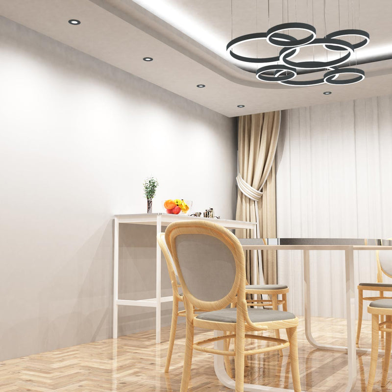 mid shot of a dining room with mounted charcoal grey CCT fixed LED downlights