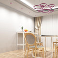 dining room with a pink LED downlight