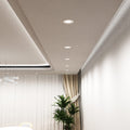 mid shot of a dining room with mounted white fixed CCT LED downlights