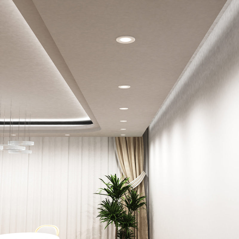 mid shot of a dining room with mounted white fixed CCT LED downlights