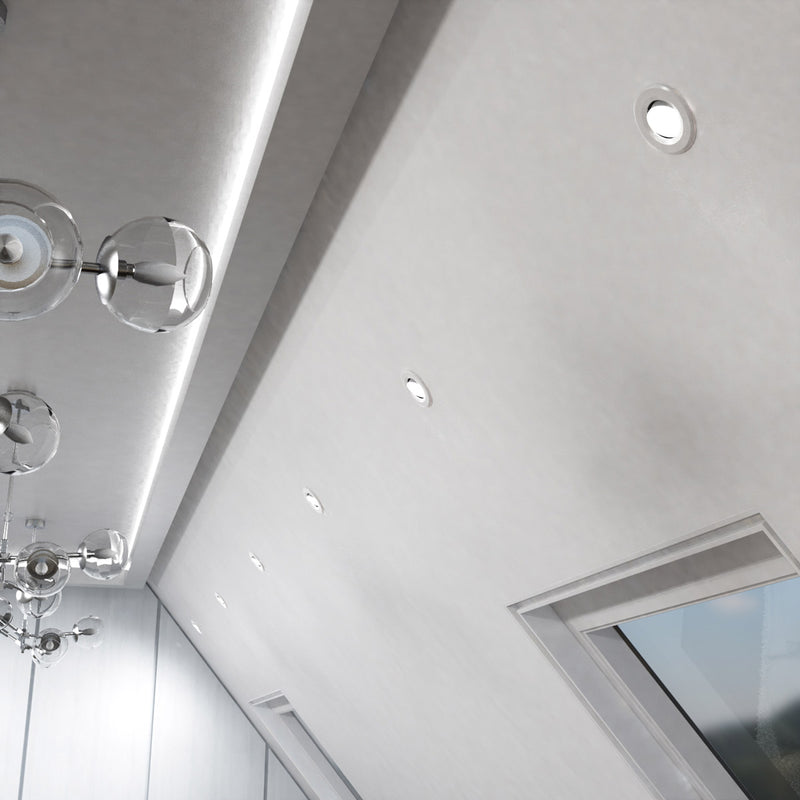 mid shot of a ceiling with a white CCT tilt downlight