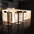 side shot of a kitchen with an illuminated island in natural white light