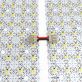 close up of two LED sheets connected by a wire