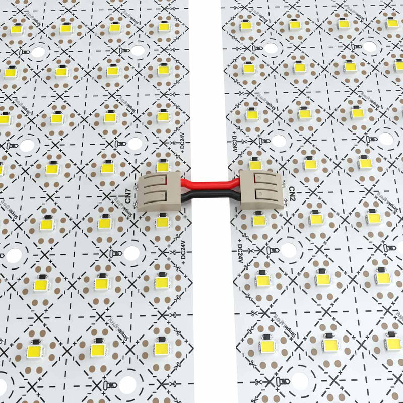 close up of two LED sheets connected by a wire