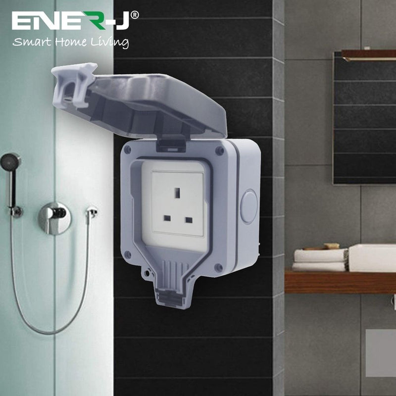 mounted smart socket with lid on a bathroom
