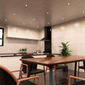 Side angle of a kitchen with black LED downlights