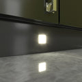 Close-up of a mounted square LED plinth light with natural white light