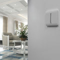1 gang light switch in white mounted on a wall