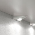 Close-up of a mounted triangle under cabinet light in a natural white light