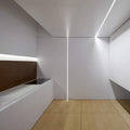Full shot of a wall and ceiling with mounted Trimless "Plaster-In" Aluminium profile