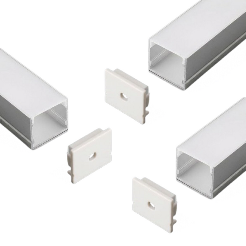 A set of three profile egdes with their end caps on a white background.
