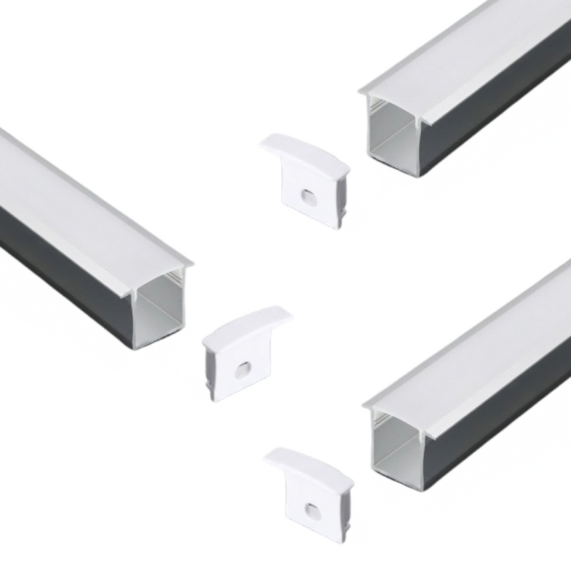A set of three recessed LED profiles with milky white diffusers on a white background with their end caps.