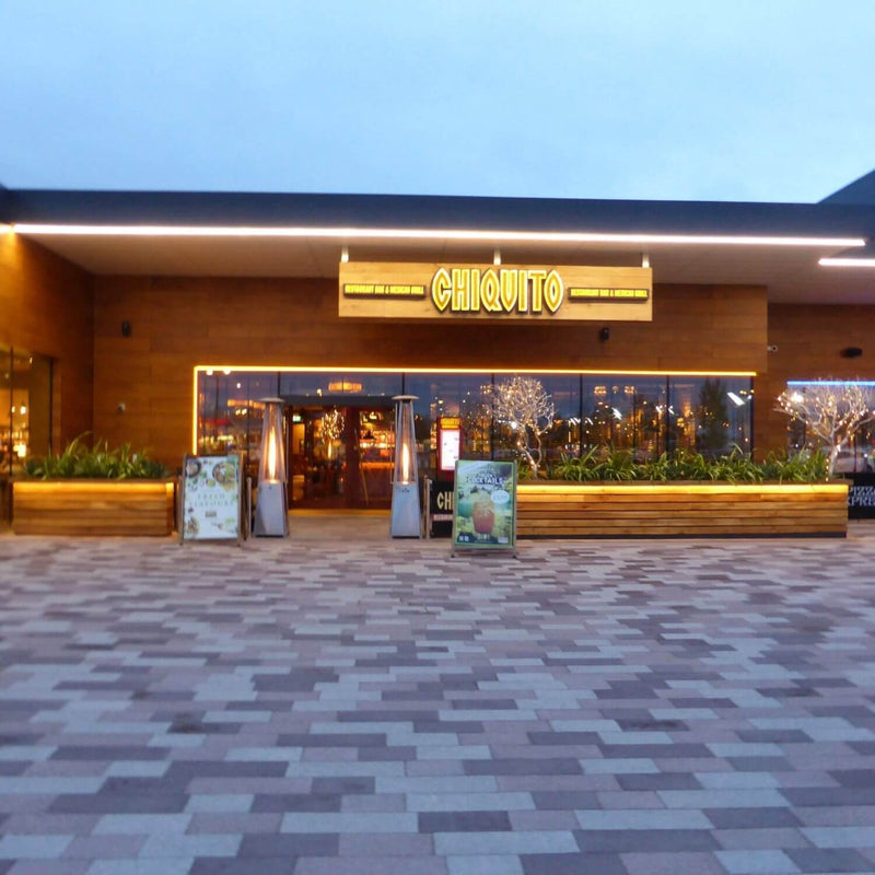 Full shot of a restaurant with warm white LED tape outlining edges