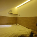 Side shot of an LED tape in warm white light on the wall